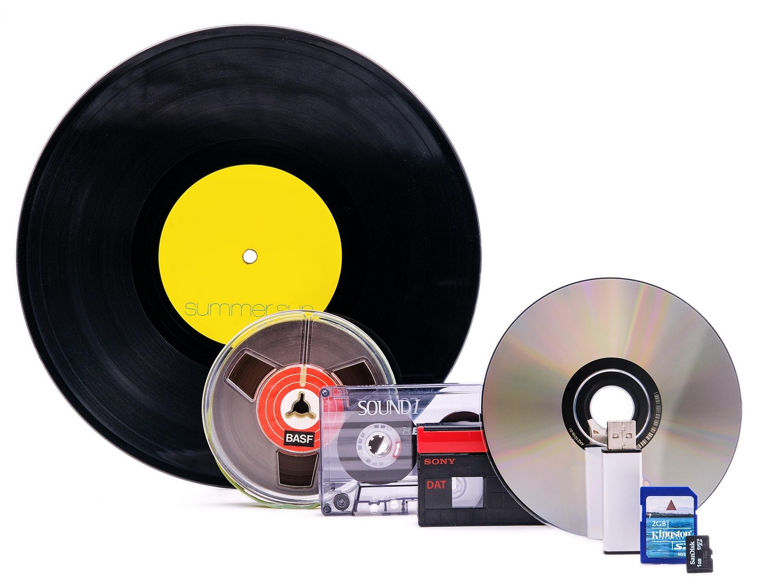 An image of various old and new audio formats and computer storage mediums.
